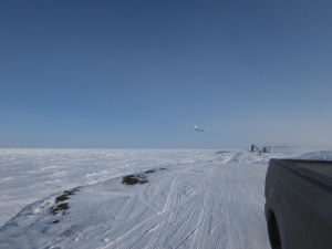 Plane landing over the Arctic Ocean